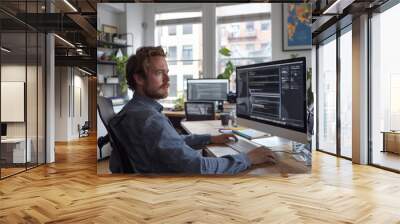 A male hip web developer at work in a modern office space. from side perspective. Generative AI. Wall mural