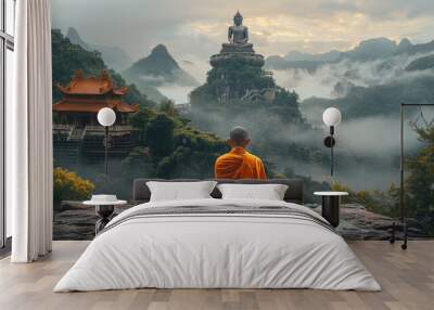 A monk meditates in front of the Buddha statue, with misty mountains and green forests behind him. The huge Buddha sits on top of a rock wall. Generative AI. Wall mural