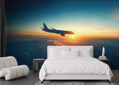 A plane is flying in the blue sky. The background is the moment of sunrise, a gradient of blue from golden yellow. Wall mural