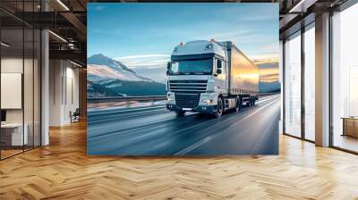 A semi truck speeding along a highway with mountains in the background, reflecting the strength and reliability of long-haul transport. Wall mural