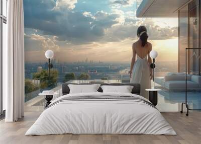 An Asian woman in a white gown standing on a large, modern, minimalist balcony at home, gazing at the distant city. The balcony is furnished with outdoor sofa. Generative AI. Wall mural