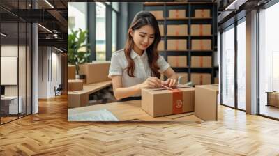 Asian woman preparing package delivery box Shipping for shopping online, Business From Home, Start up small business owner at home online order. Wall mural