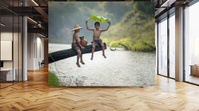 Children poverty living in countryside Vietnam are fishing at the river,Rural concept of Asia Wall mural