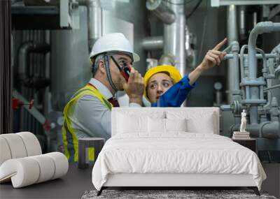 electrical engineer working in control room of a modern thermal power plant at large industry factor Wall mural