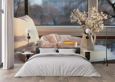 Elegantly decorated window sill with a glass of coffee and a white blanket. Wall mural