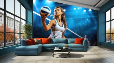 Female professional volleyball players in action on grand court at stadium. Wall mural