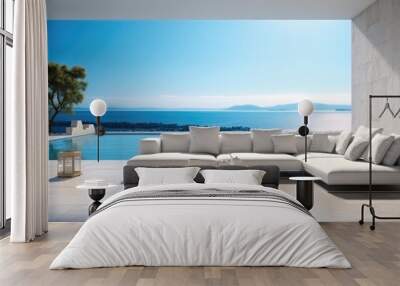 Interior modern open plan lounge patio close to the pool and ocean in background on one side behind the wall, White lounge suite. Wall mural