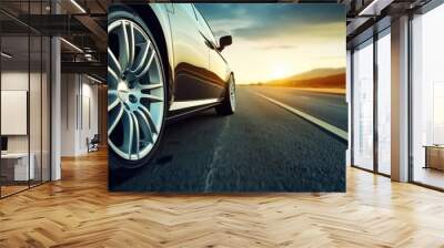 On the Road, Car tire speeding along country road sunset. Wall mural