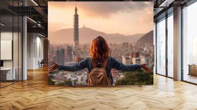 Rear view young woman traveler looking beautiful cityscape at sunset, Travel lifestyle concept. Wall mural