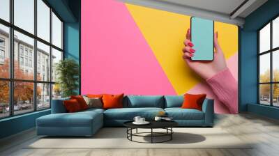 Female Hand with Mobile Phone on Color Background Wall mural