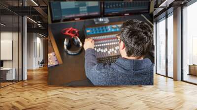 Audio technician working in sound studio Wall mural