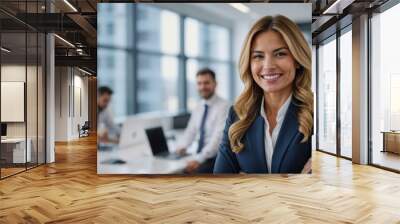 Female leader, manager or CEO with a smile, mission and vision in the office and her team in the background. Leadership, management and success with a woman boss and corporate business people at work Wall mural