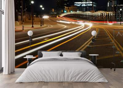 Atlanta, Georgia USA - 2 17 2024: Light trail photograph of passing cars at night in city.  Atlanta on street near Atlantic Station in Atlanta. Abstract photography with light trails causing cars to l Wall mural