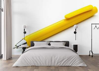 A yellow ballpoint pen isolated on a white background. Wall mural