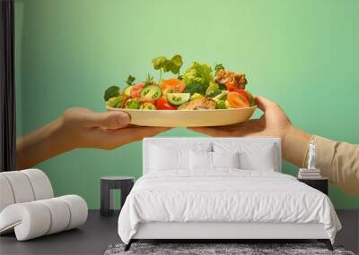 A pair of small hands gripping a paper plate adorned with a fresh salad, Wall mural