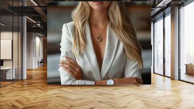 A beautiful blonde woman in white suit and watch. Wall mural