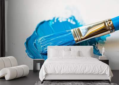 A blue paint brush on a white surface. Wall mural