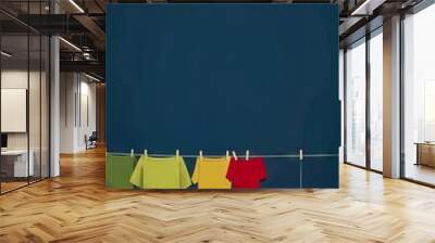 A line of clothes hanging on a clothesline. Wall mural