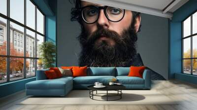 A man with glasses and a beard. Wall mural