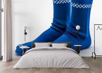 A pair of blue socks with white and blue designs. Wall mural