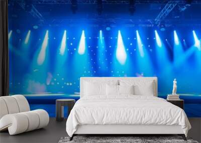 A stage with bright lights and a dark floor. Wall mural