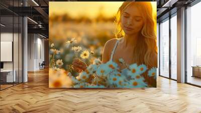 A woman in a field of daisies at sunset. Wall mural