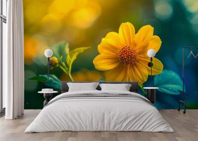 A yellow flower with green leaves in the sunlight. Wall mural