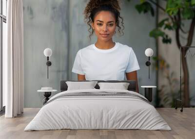 A young woman in jeans and white t - shirt. Wall mural