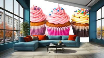 Three cupcakes with pink frosting and sprinkles on a white background Wall mural