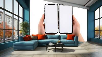 Two hands holding two iphones with white screen and black edges. Wall mural