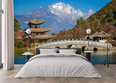 Bridge and pagoda pavilion at the Black Dragon Pool with Yulong Snow Mountain in the background. Lijiang, Yunnan, China Wall mural