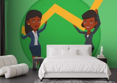 Two business women holding growth graph. Wall mural