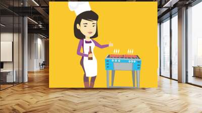 Woman cooking steak on barbecue grill. Wall mural