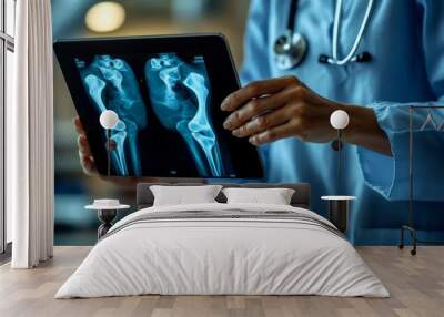 Orthopedics surgeon doctor using digital tablet and examining and recording patient's knee joint x-ray films, MRI bone, ct scan at radiology orthopedic unit in hospital. knee joint film, Generative AI Wall mural