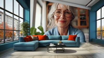 Smiling mature 60s middle aged woman looking at web camera video conference calling in virtual web chat remote business meeting by social distance remote video cal. Head s face portrait, Generative AI Wall mural