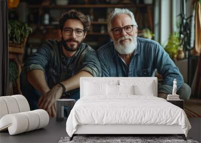 A portrait of adult hipster son and senior father sitting on floor indoors at home, Generative AI Wall mural