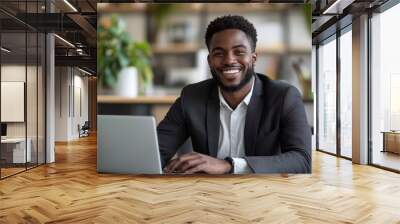 Happy entrepreneur working on laptop at modern office table, Generative AI Wall mural