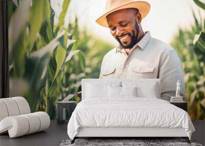 A modern farmer in a corn field using a digital tablet. Farming and agriculture concept. Wall mural