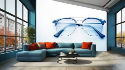 A sleek pair of sunglasses, ready to shield the eyes from the sun's rays in style, displayed against a clean white background. Wall mural