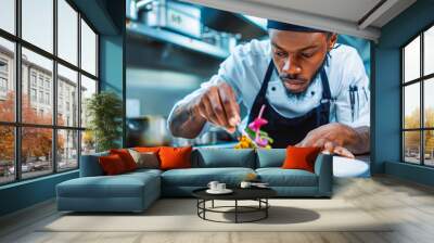 Black chef garnishes a colorful, artistic dish with a flourish, a master at work. Wall mural