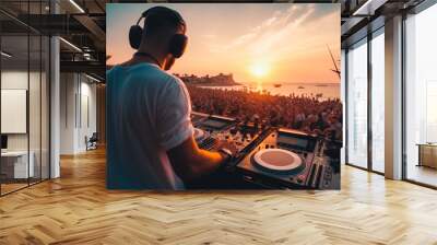 DJ mixing and playing music outdoor at festival with crowd dancing. Wall mural