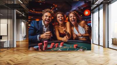 Group of happy friends playing and winning poker at casino, gambling games Wall mural