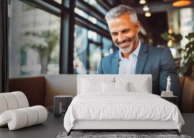 Happy middle aged man ceo wearing a suit working on tablet computer. Generative AI Wall mural