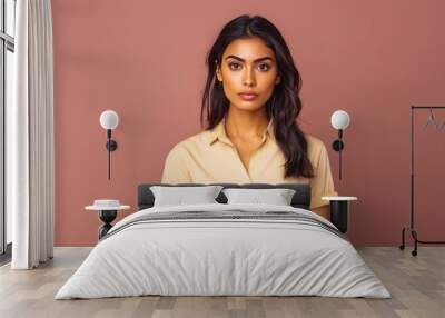 portrait of beautiful indian female looking serious in casual clothes on a colored background Wall mural