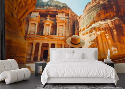 Sightseer walking through the ancient city of Petra, Jordan. Wall mural