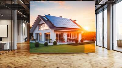 Solar panels on large family house with sunset light in the background Wall mural