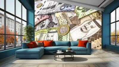 Saudi Riyal currency background with coin and paper bill backdrop Wall mural