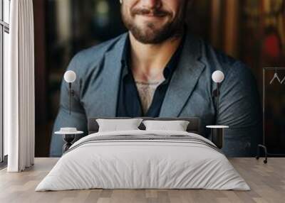 A confident man displaying his facial hair wearing a gray jacket Wall mural