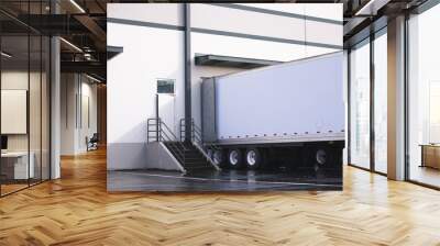 Dry van semi trailer loading and unloading commercial cargo in warehouse dock Wall mural