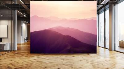 Pink sunset in the mountains. Wall mural